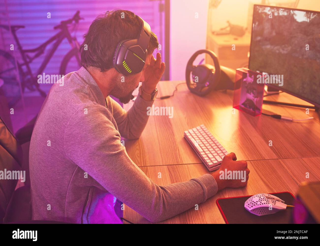 Headache, gamer or man on computer with depression from loss, fail or ...