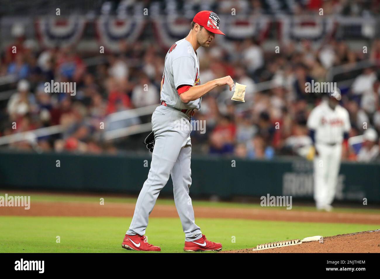 ATLANTA, GA - JULY 04: James Naile (68) of the St. Louis Cardinals goes to  the rosin bag before taking the mound during the Monday evening MLB game  between the Atlanta Braves