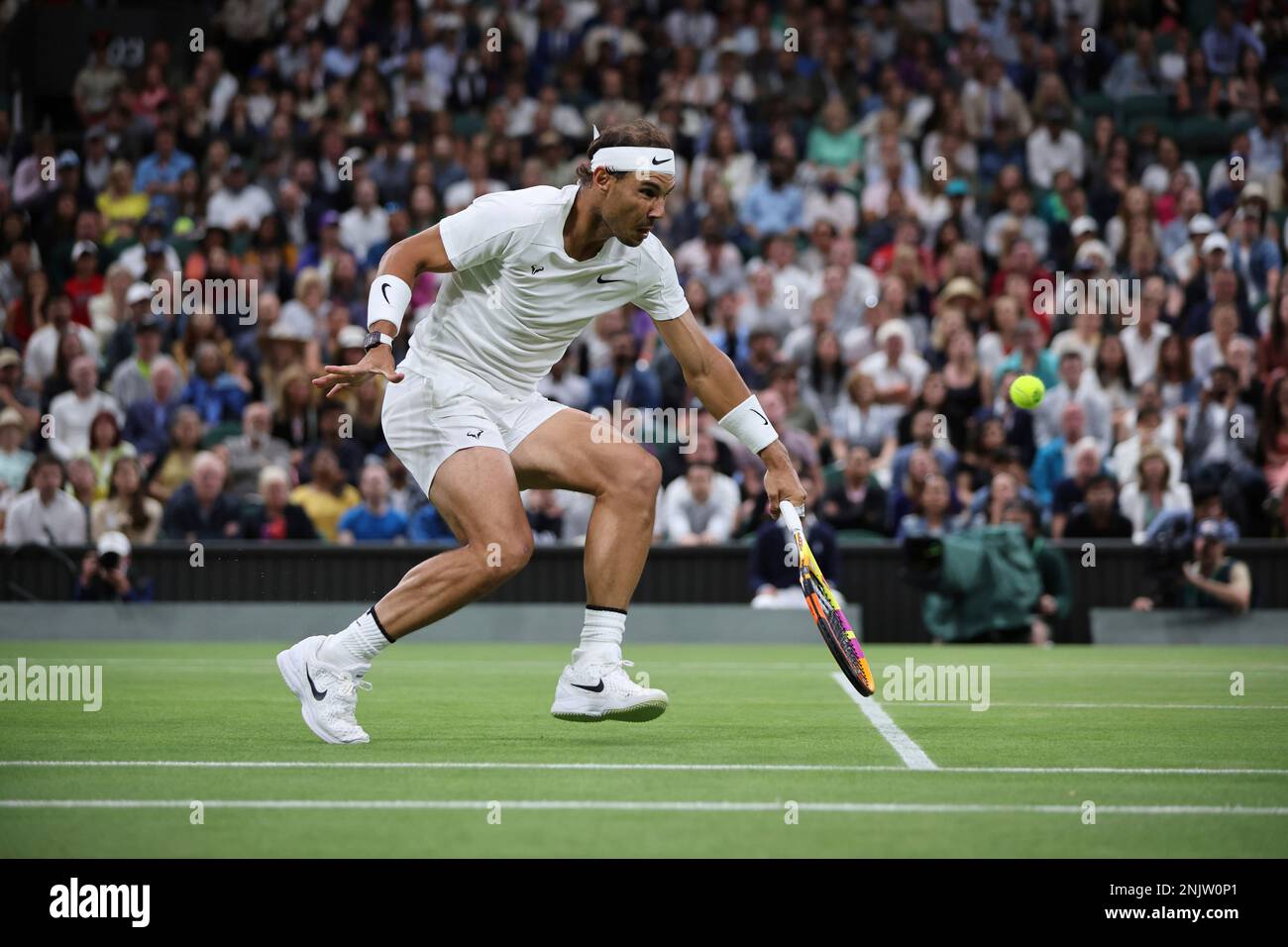 Rafael Nadal of Spain hits a return to Lorenzo Sonego of Italy during the game of the gentlemens singles third-round match in the Championships, Wimbledon at All England Lawn Tennis and Croquet