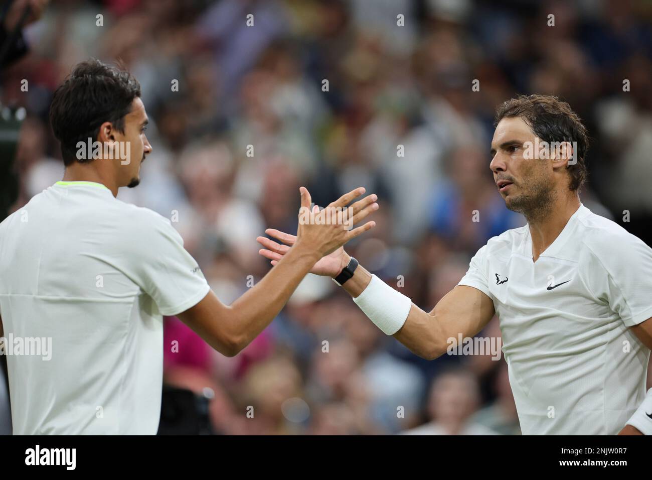 Rafael Nadal (R) of Spain defeats Lorenzo Sonego of Italy during the game of the gentlemens singles third-round match in the Championships, Wimbledon at All England Lawn Tennis and Croquet Club in