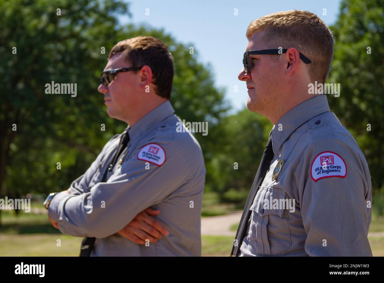 Harlan County Lake Park Rangers Bryson Hellmuth (left) and Ryan Spry (right) listen during Col. Geoff Van Epps', Northwestern Division commander, visit to Harlan County Lake, Nebraska, on Aug. 10, 2022. Col. Van Epps' visit to the Kansas City District included tours of district programs and projects to meet with partners and district staff and to learn how the District is working with the Heartland. Stock Photo