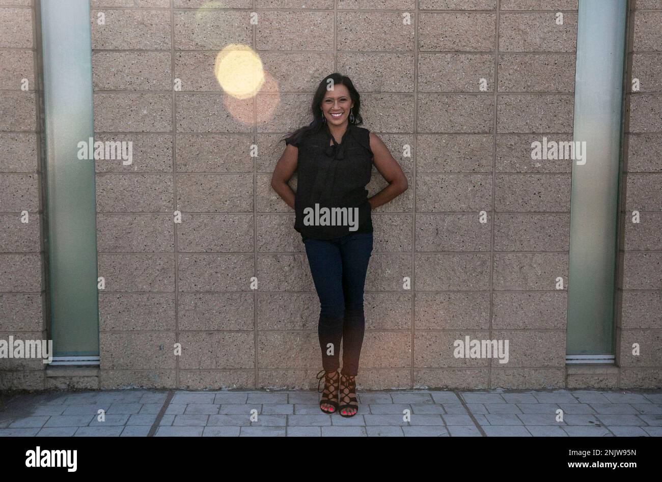 Musician Jocelyn Enriquez, also known as the "Queen of Freestyle," poses outside 7 Mile House