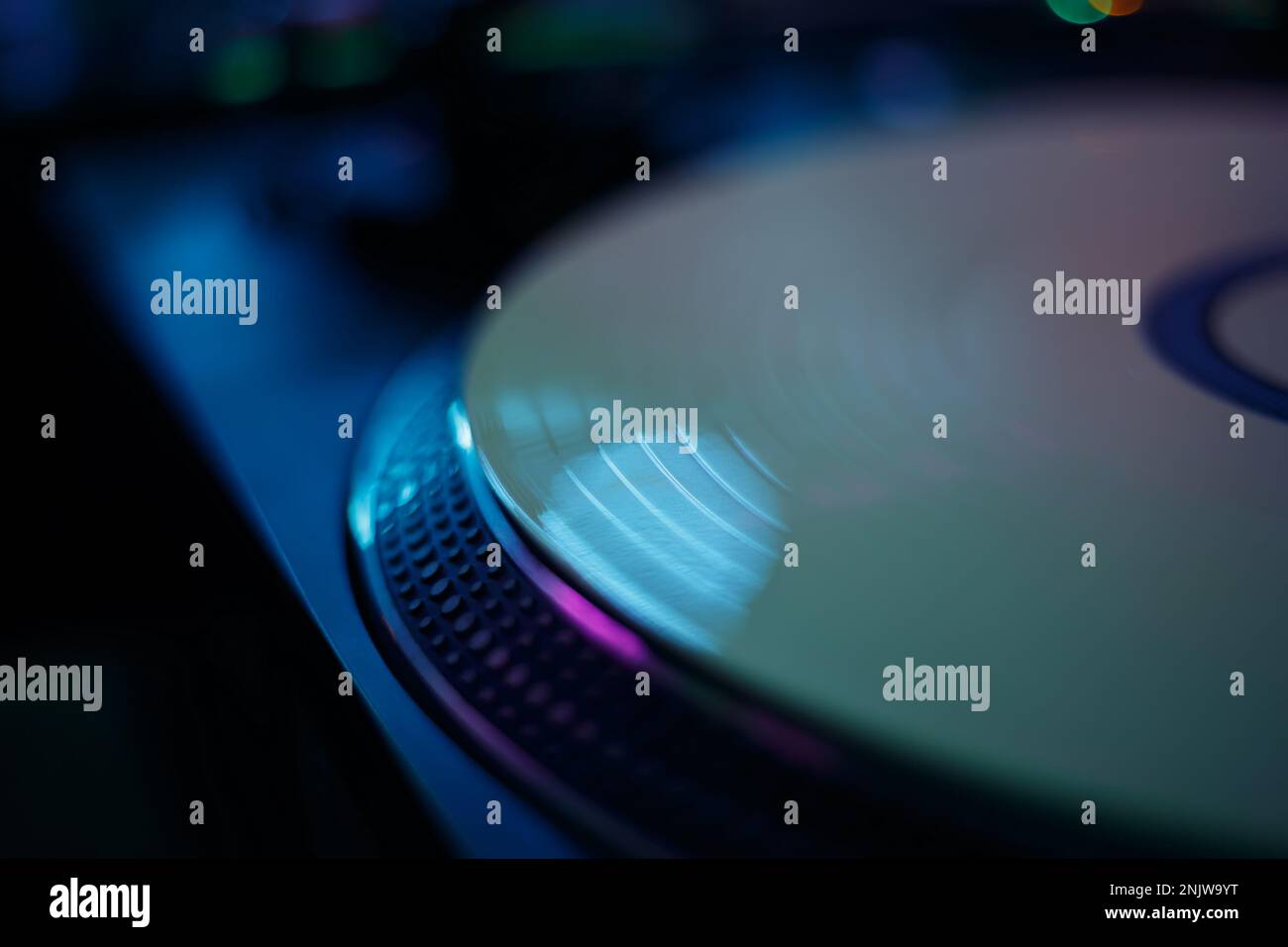 Vinyl record player on stage in night club. DJ turntable on hip hop party Stock Photo Alamy