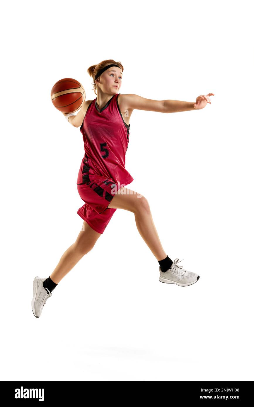 Teen girl, professional female basketball player in motion, throwing