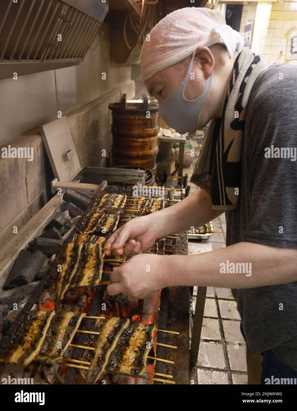 Eels are grilled for Kabayaki at a Unagi restaurant Wakana in Yokohama