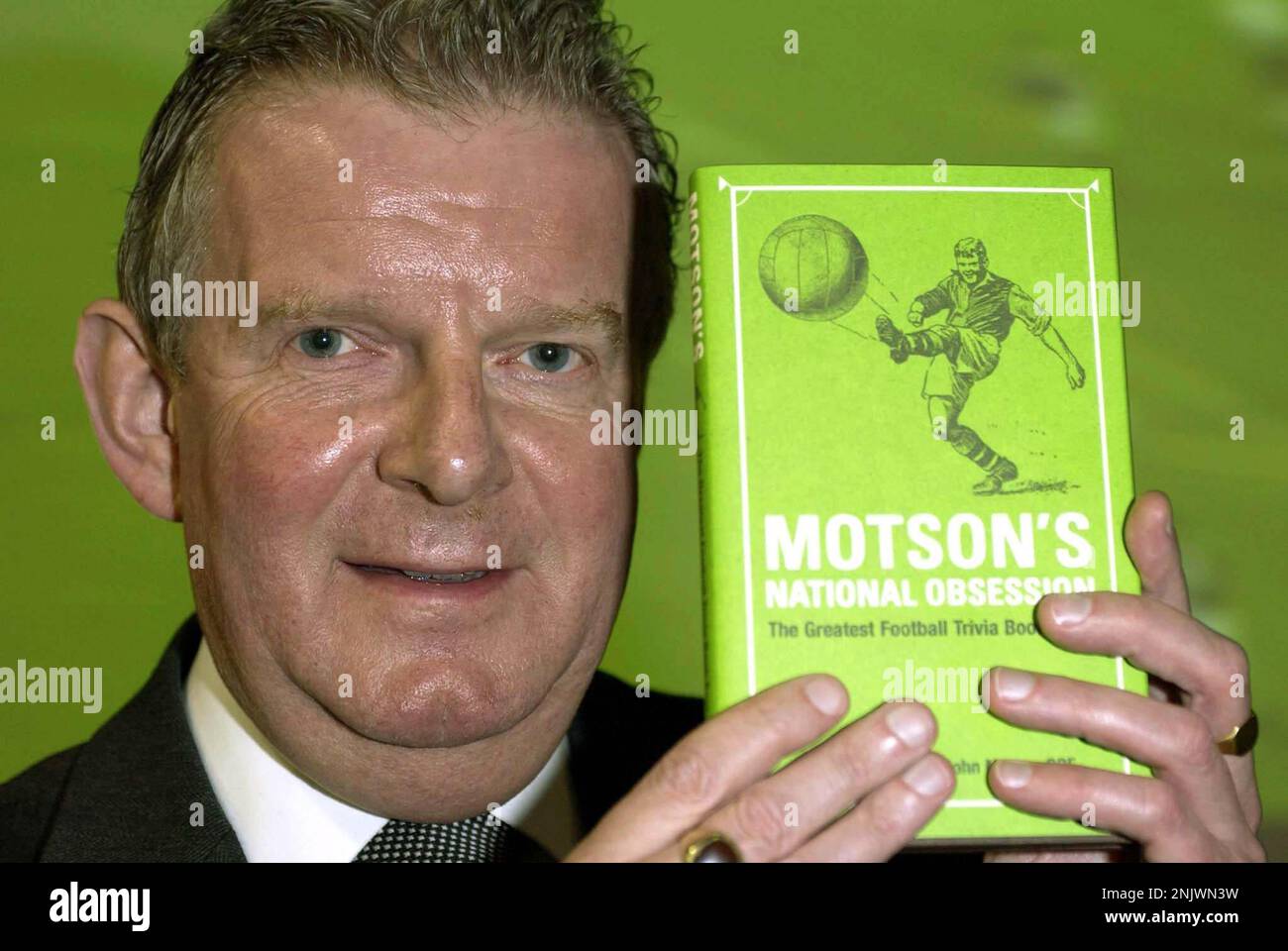 File photo dated 4-05-2004 of Football commentator John Motson during a book signing at Virgin Megastore in Oxford Street, central London, to promote his new book 'Motson's National Obsession - The Greatest Football Trivia Book Ever'. Football commentator John Motson has died at the age of 77, the BBC has announced. Issue date: Thursday February 23, 2023. Stock Photo