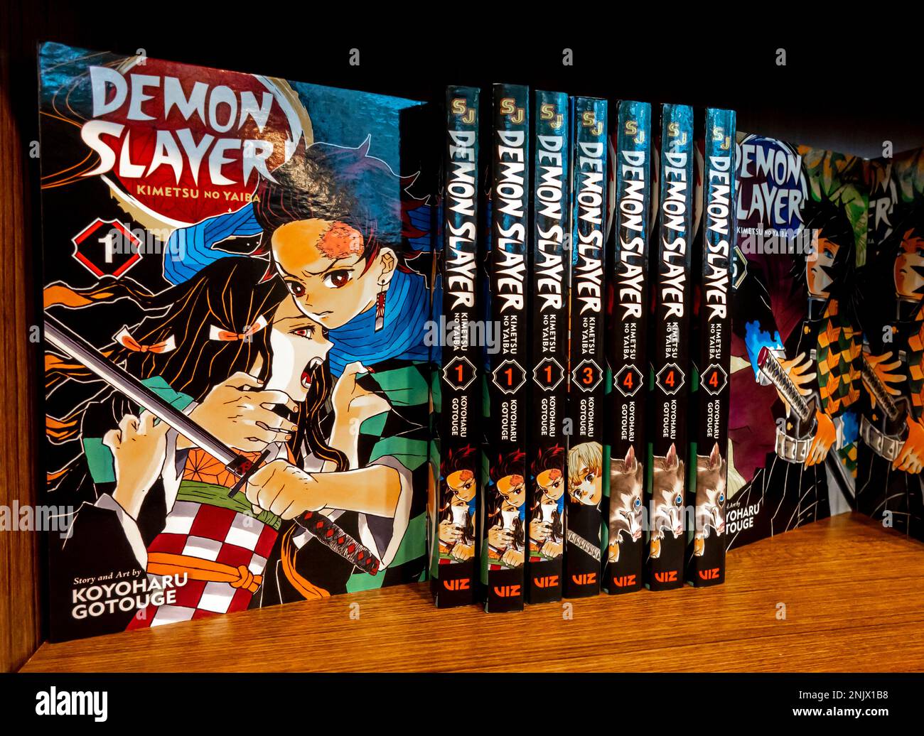 https://c8.alamy.com/comp/2NJX1B8/demon-slayer-kimetsu-no-yaiba-manga-series-books-on-a-shelf-2NJX1B8.jpg