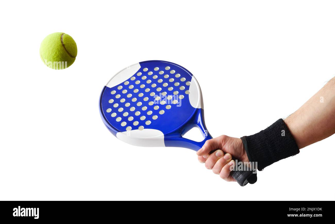 Background of hand with paddle racket hitting a ball with white isolated background.. Front view. Stock Photo