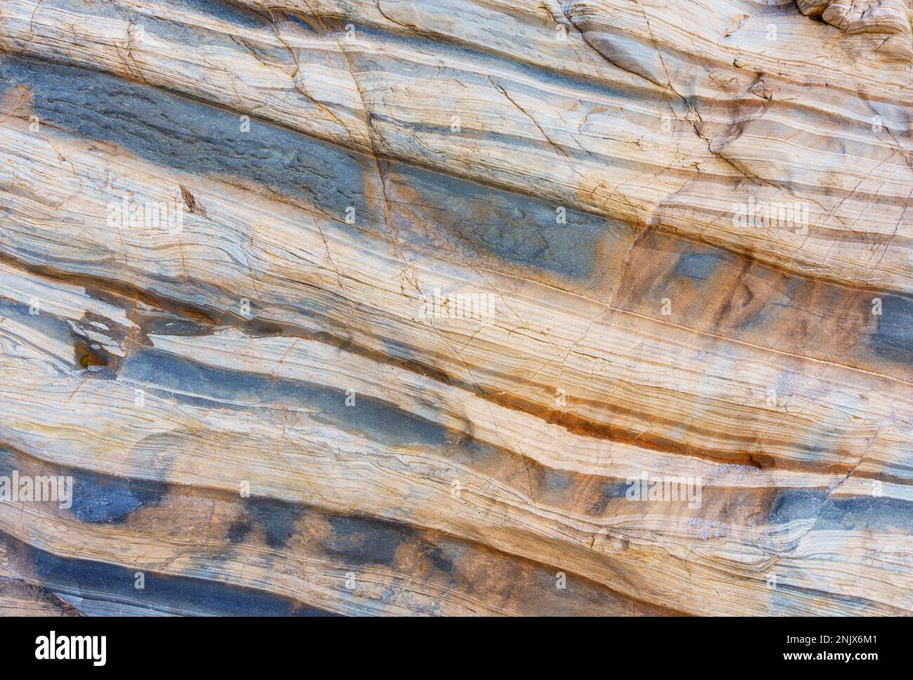 Malibu coast rock formations background. Elegant and eye-catching layered rocks pattern. Stock Photo