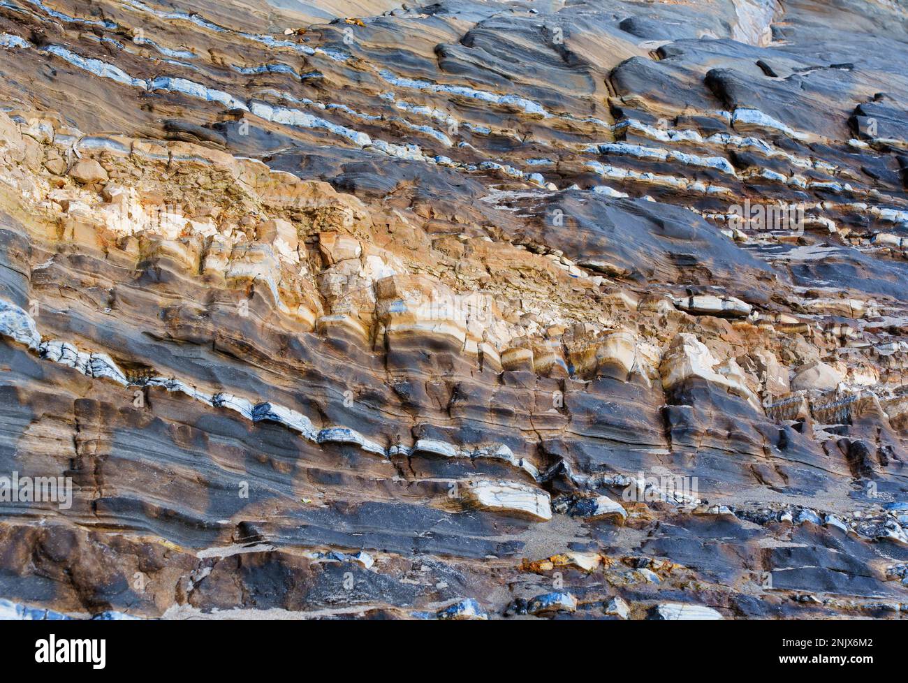 Natural beauty and texture of layered rocks. Earthy and organic abstract background. Stock Photo
