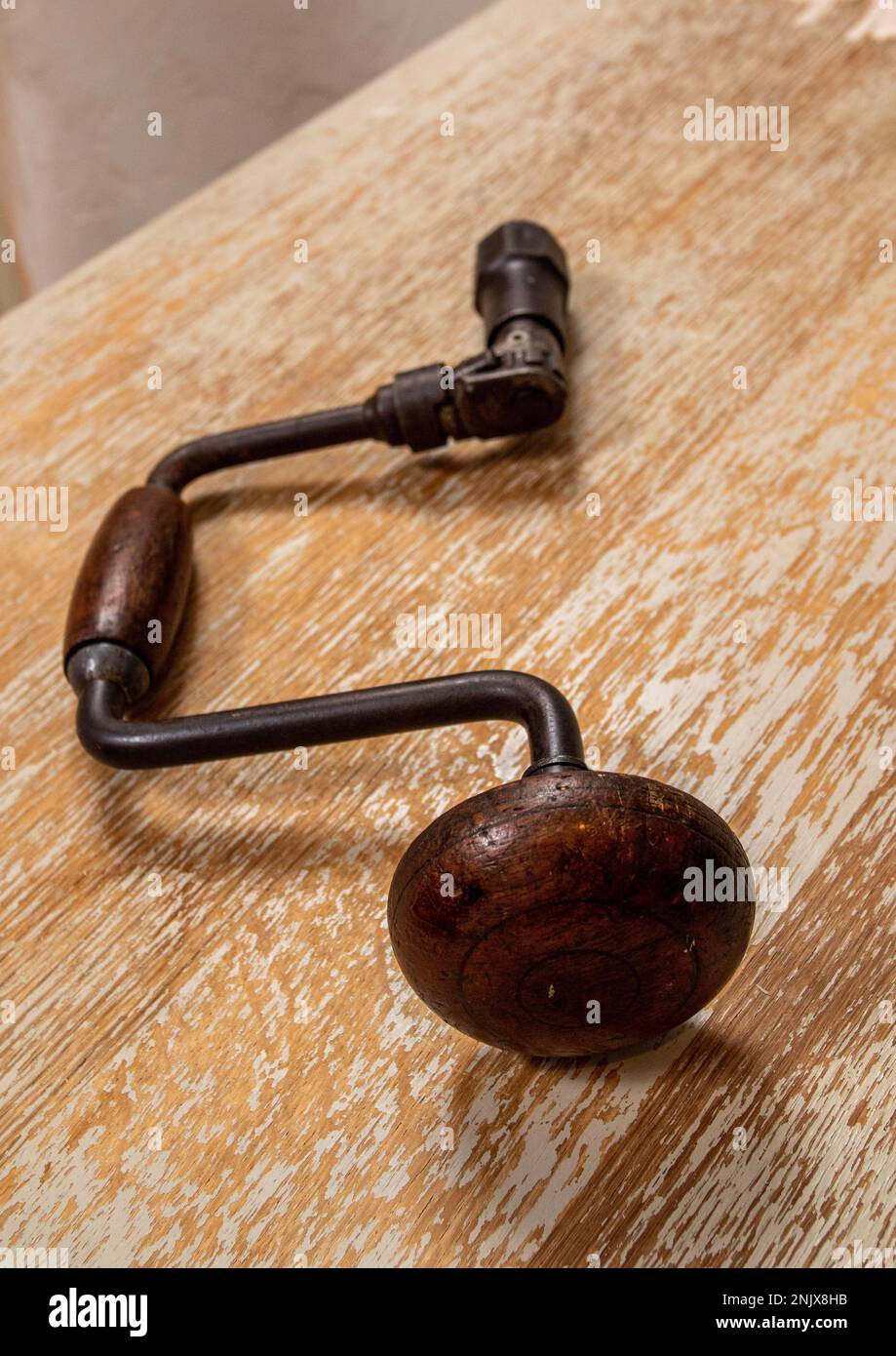 Vintage and traditional carpenter's racheting brace with wooden handles