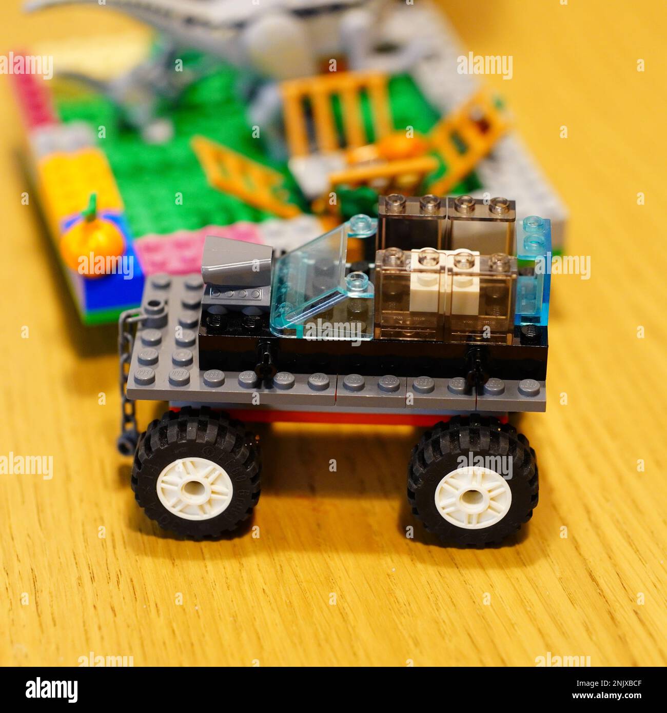 A lego car with a remote controller on a wooden table Stock Photo Alamy
