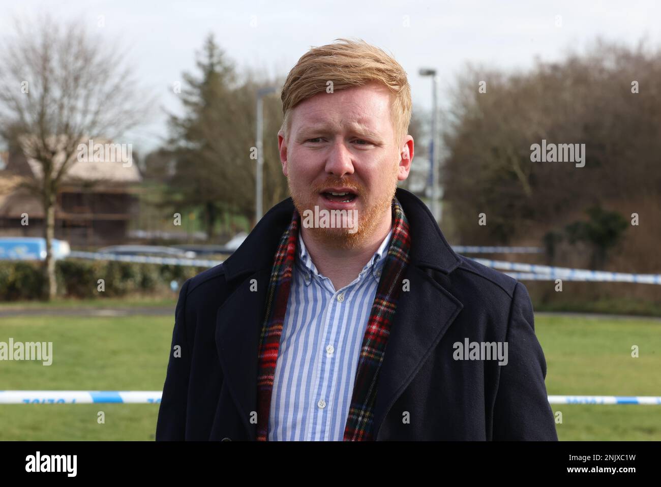 Daniel McCrossan from the SDLP giving an interview at the sports complex in the Killyclogher Road area of Omagh, Co Tyrone, where off-duty PSNI Detective Chief Inspector John Caldwell was shot a number of times by masked men in front of young people he had been coaching. Mr Caldwell remains in a critical but stable condition in hospital following the attack on Wednesday evening. Picture date: Thursday February 23, 2023. Stock Photo
