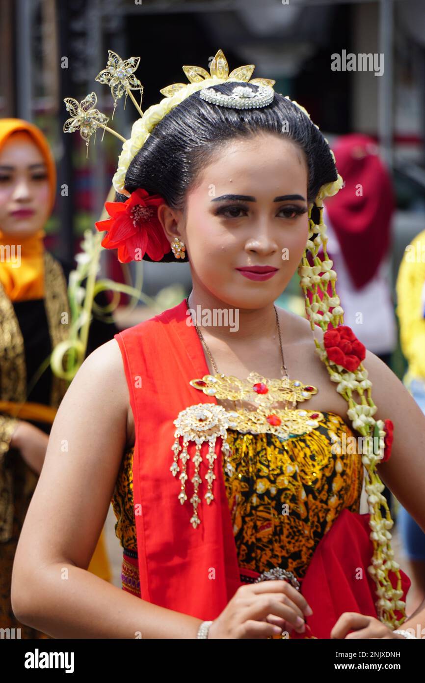 Indonesian with a traditional javanese cloth on 1800 chocolate ketupat ...