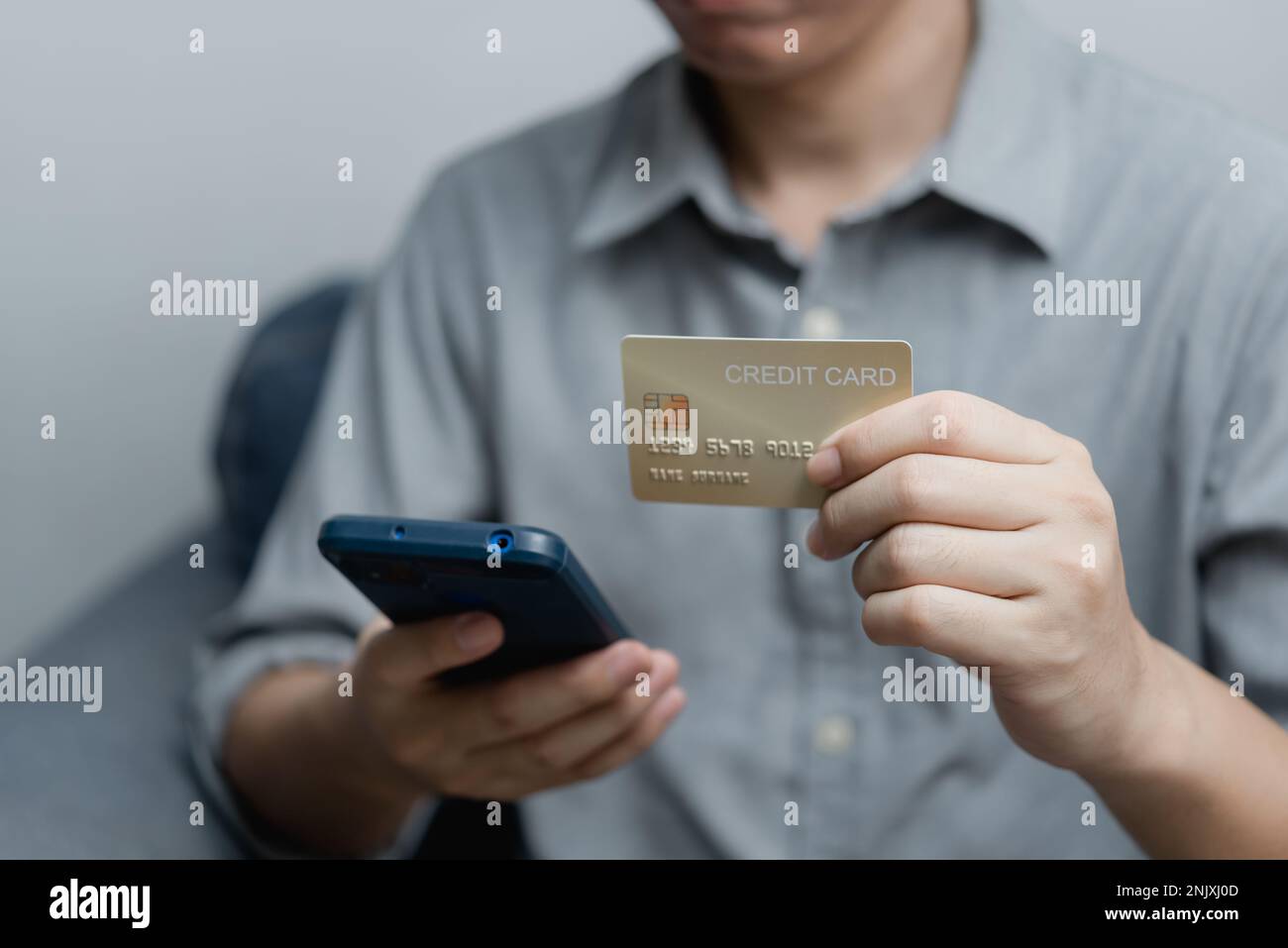 businessman using credit card and smartphone login to internet bank.Online shopping, e-commerce, internet banking, and financial transactions payments Stock Photo