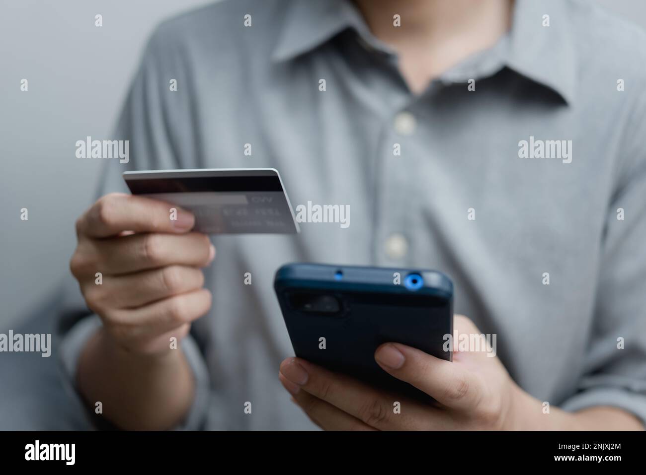 businessman using credit card and smartphone login to internet bank.Online shopping, e-commerce, internet banking, and financial transactions payments Stock Photo