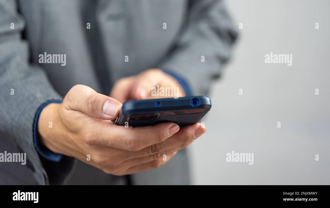 man using mobile smart phone.Digital technology communications concept. Stock Photo