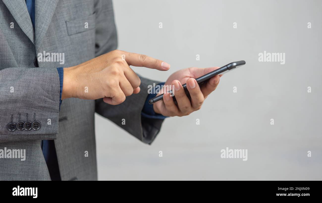 man using mobile smart phone.Digital technology communications concept. Stock Photo