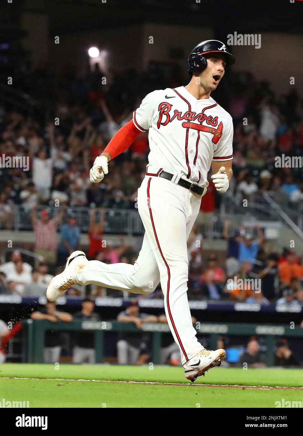 Atlanta Braves relief pitcher Raisel Iglesias, right, reacts with first  baseman Matt Olson, center, and third baseman Austin Riley (27) following  their victory over the Milwaukee Brewers in a baseball game Sunday