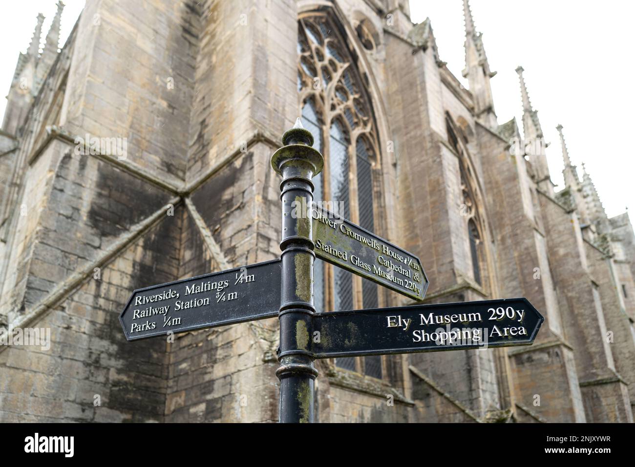 Shallow focus of wrought iron public direction signs in the famous city. Part of the cathedral is seen in the background. Stock Photo
