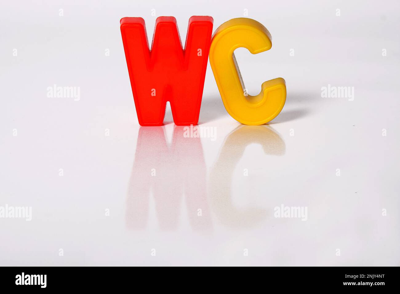 colourful characters building the word WC, toilet Stock Photo Alamy