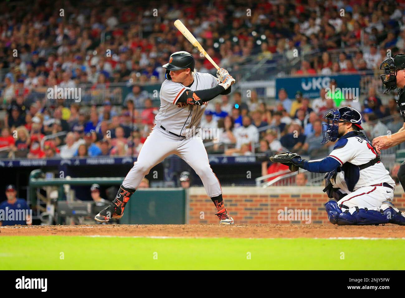 ATLANTA, GA - JUNE 20: Former Brave Joc Pederson #23 of the San Francisco  Giants and his daughter Poppy prior to the Monday evening MLB game between  the Atlanta Braves and the