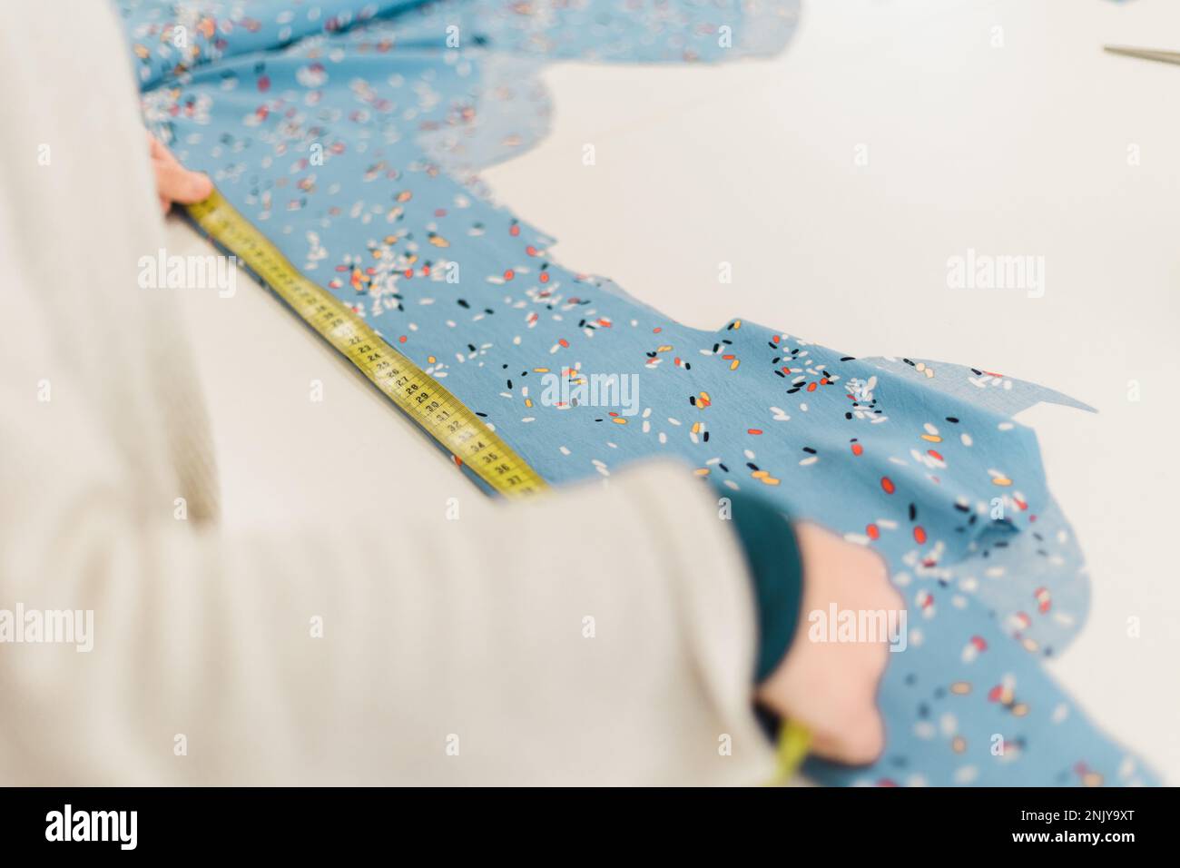 Textile Measuring Crop unrecognizable dressmaker measuring hi-res stock photography and ...