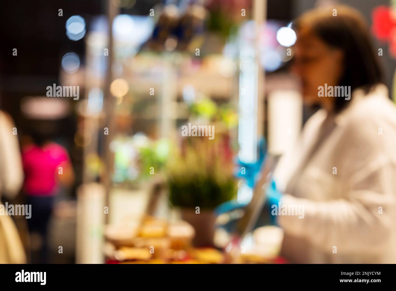 Blurred Shot Of People Walking Indoors At Food And Food Technology Exhibition, Riga, Latvia. Stock Photo