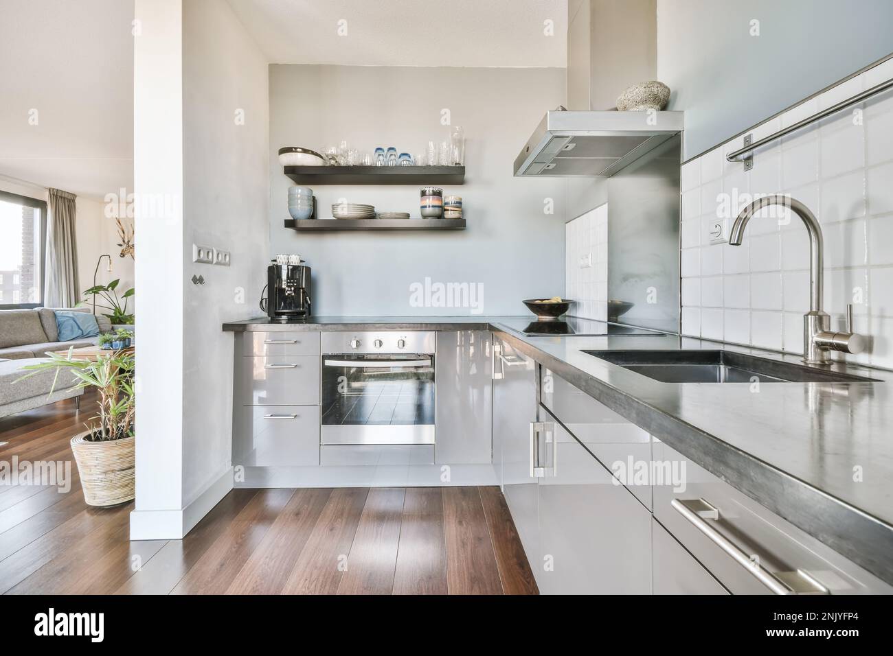 Interior design of contemporary kitchen with gray cupboards marble