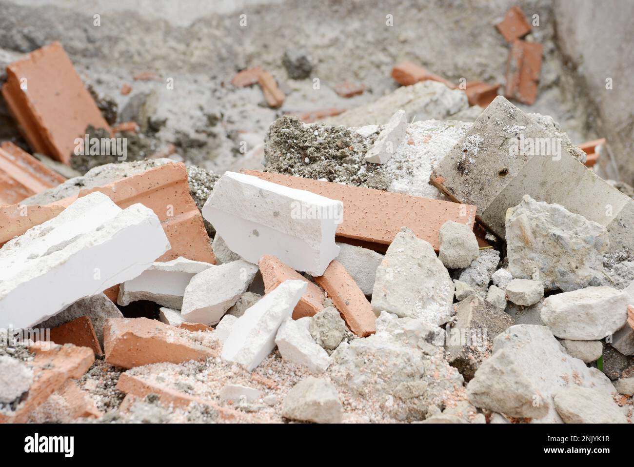 Building rubble, destroyed bricks in the rubble container when building a house Stock Photo