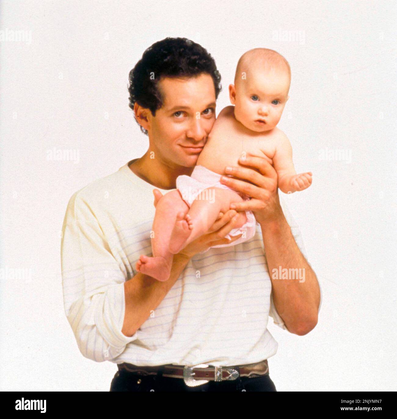 STEVE GUTTENBERG in THREE MEN AND A BABY (1987), directed by LEONARD ...