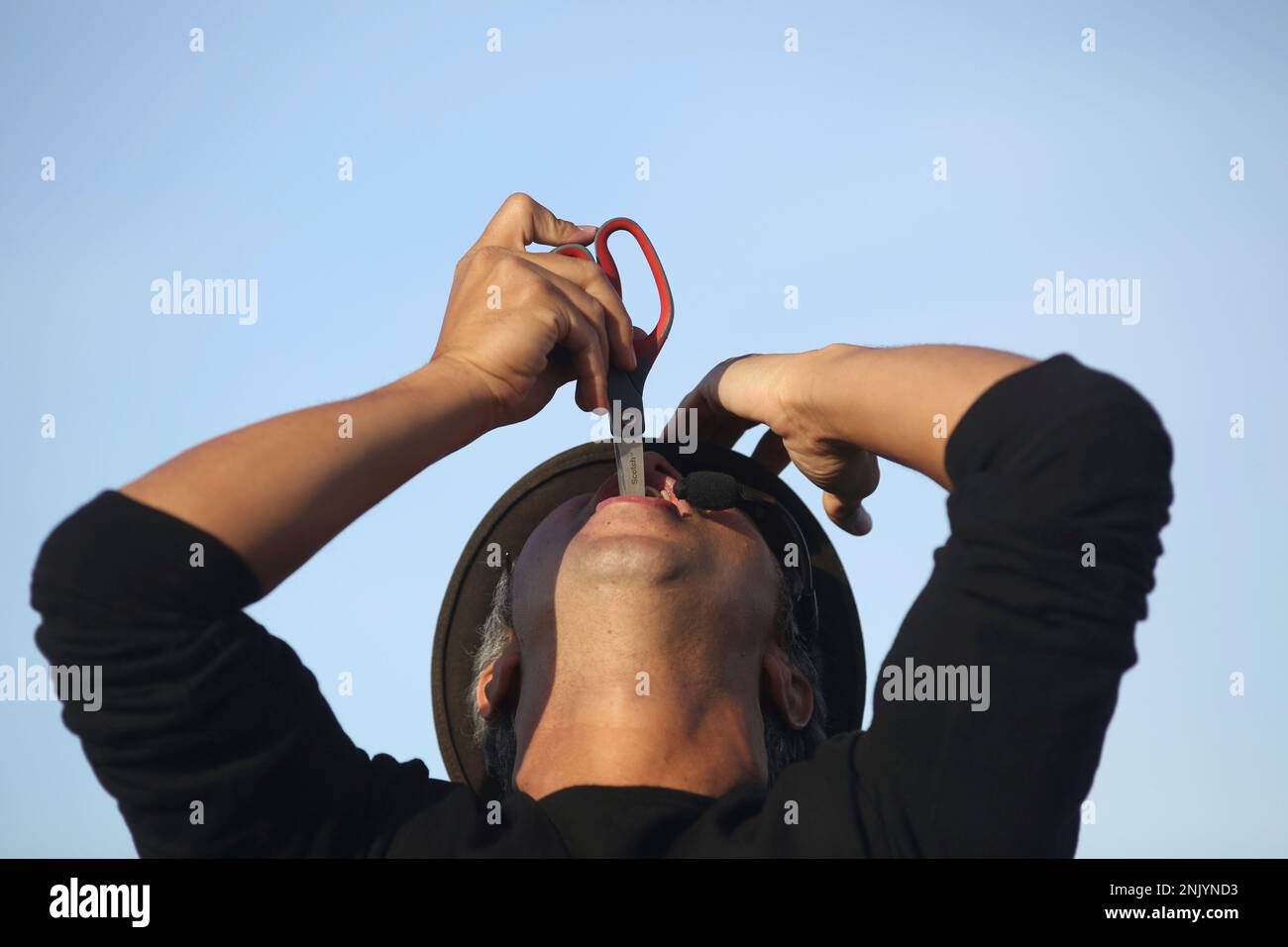 Using a pair of scissors, Lynx the Animator tries to find a balloon he  swallowed earlier in his act at Fisherman's Wharf in San Francisco. (Mike  Kepka/San Francisco Chronicle via AP Stock