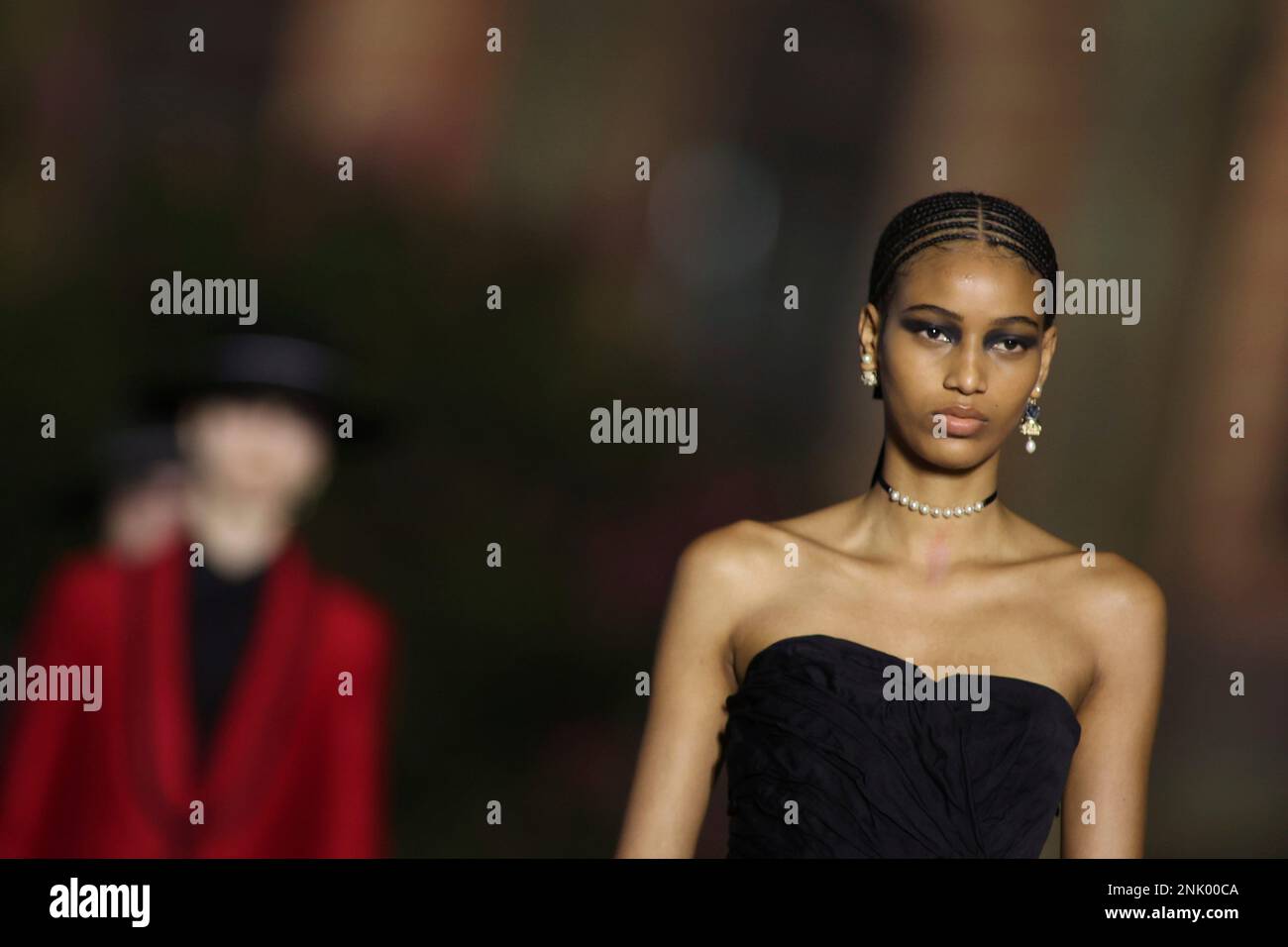 A model dressed in red at the Dior fashion show in Seville to present its Cruise 2022 collection on June 16 2022 in Seville Andalusia Spain. JUNE 16 2022 Joaquin Corchero Europa