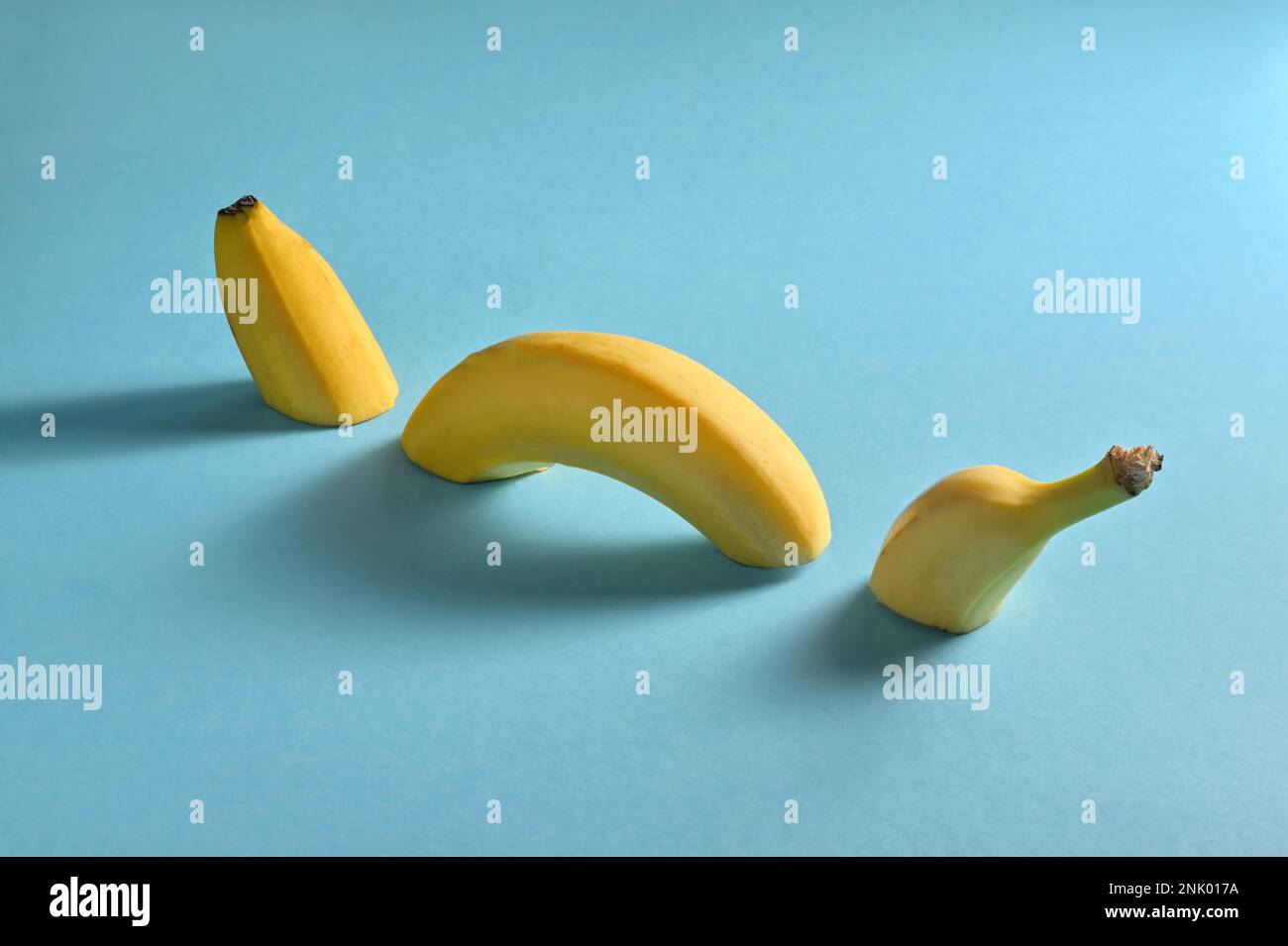 Abstract Sliced Banana like an Marine Animal Isolated On Blue Background Stock Photo