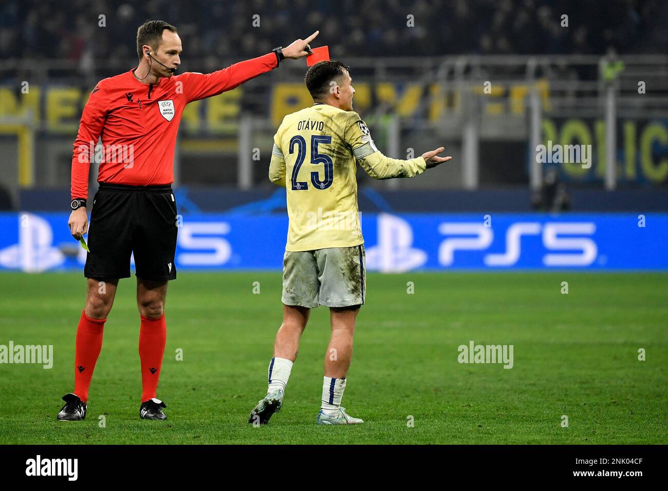 Referee Srdjan Jovanovic shows a red card to Otavio Edmilson da Silva Monteiro of FC Porto during the Champions League football match between FC Inter Stock Photo