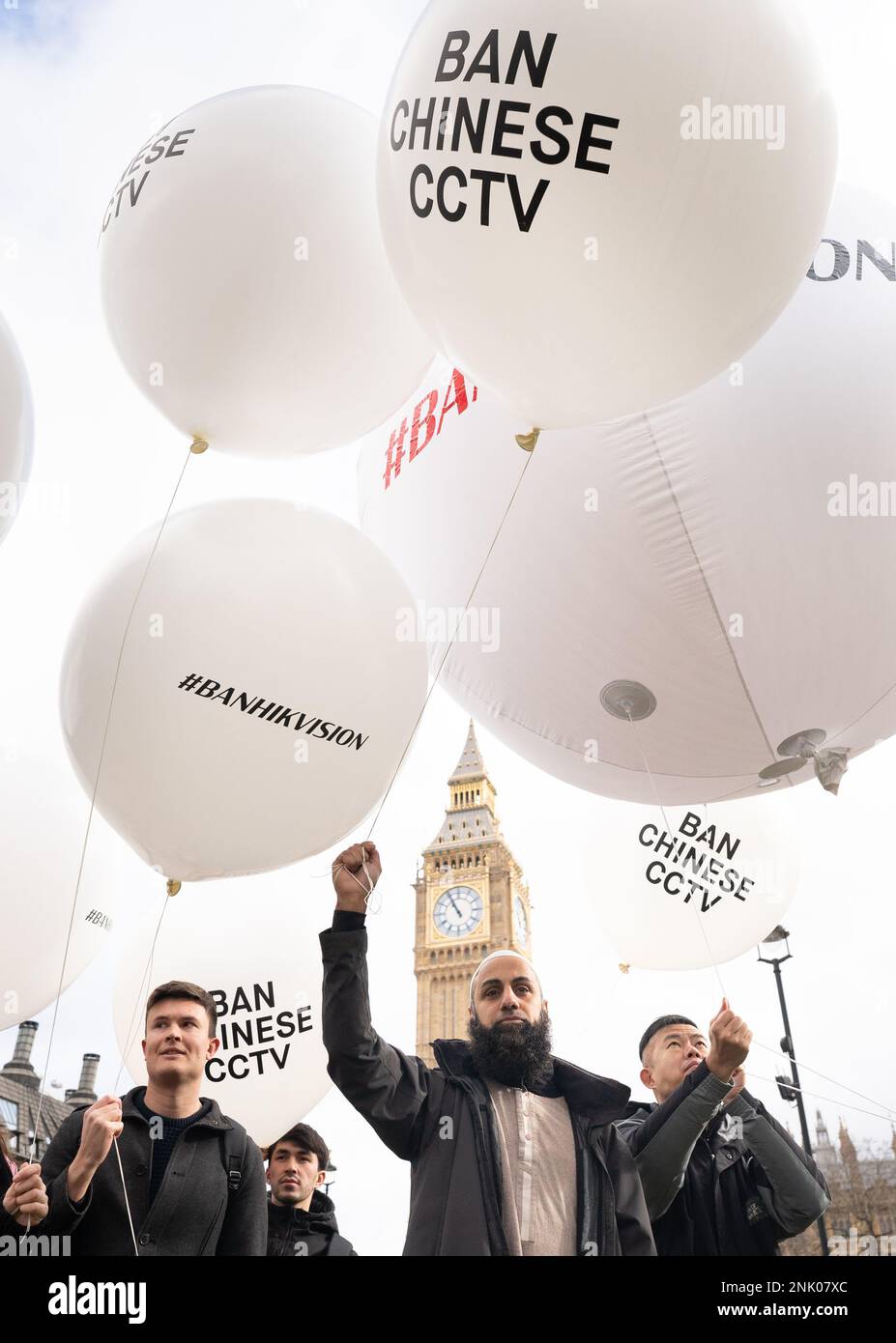 Protesters from the Big Brother Watch lobby group hold large white
