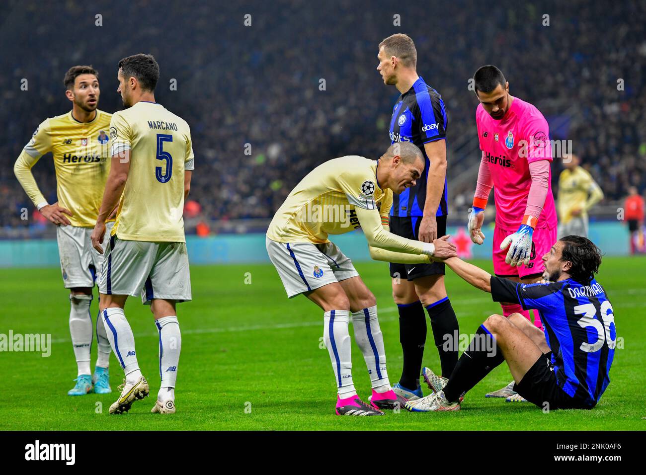 Milano, Italy. 22nd Feb, 2023. Pepe (3) of FC Porto gives a hand to Matteo Darmian (36) of Inter during the UEFA Champions League match between Inter and FC Porto at Giuseppe Meazza in Milano. (Photo Credit: Gonzales Photo/Alamy Live News Stock Photo