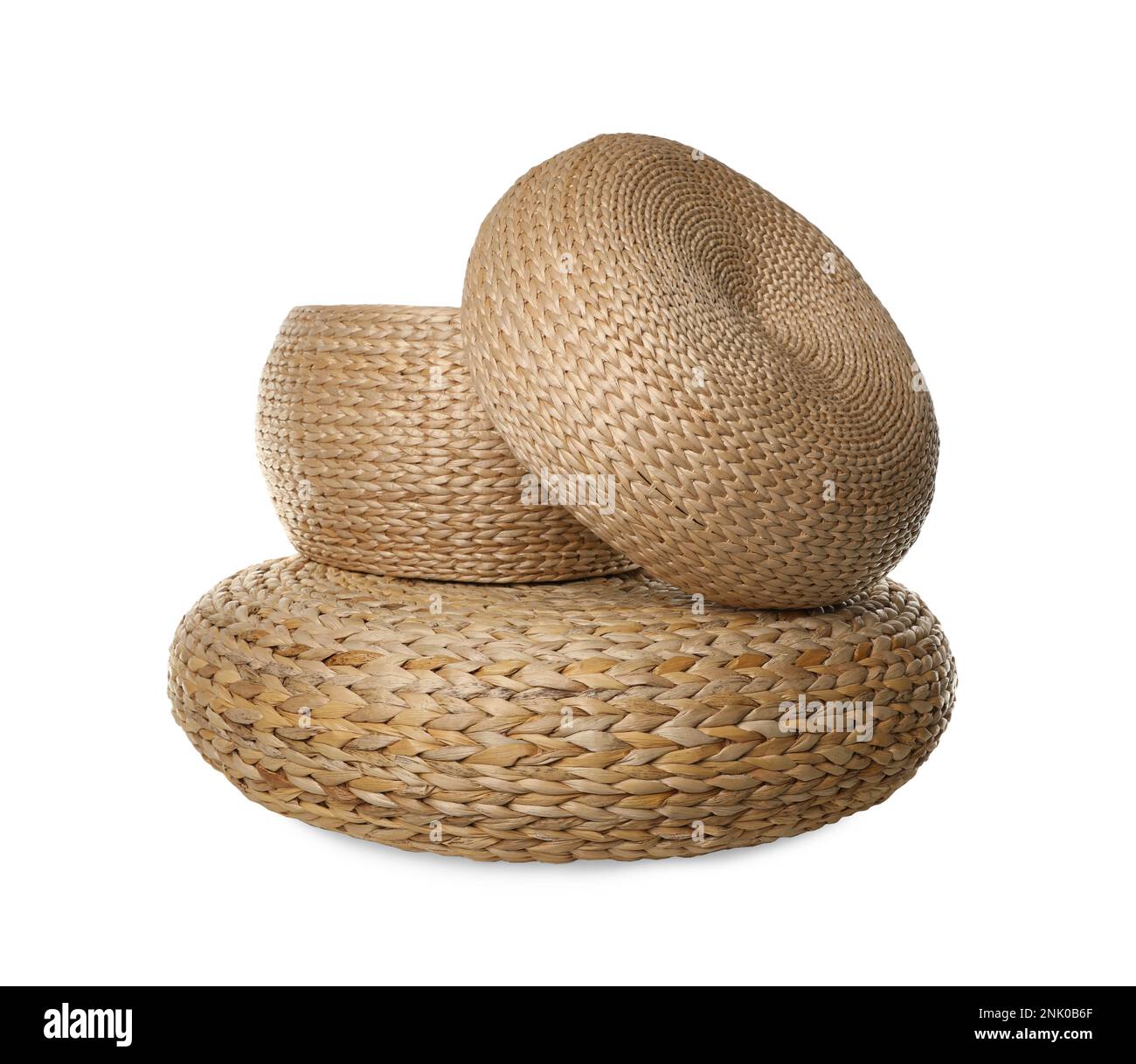 Three stylish wicker poufs on white background Stock Photo