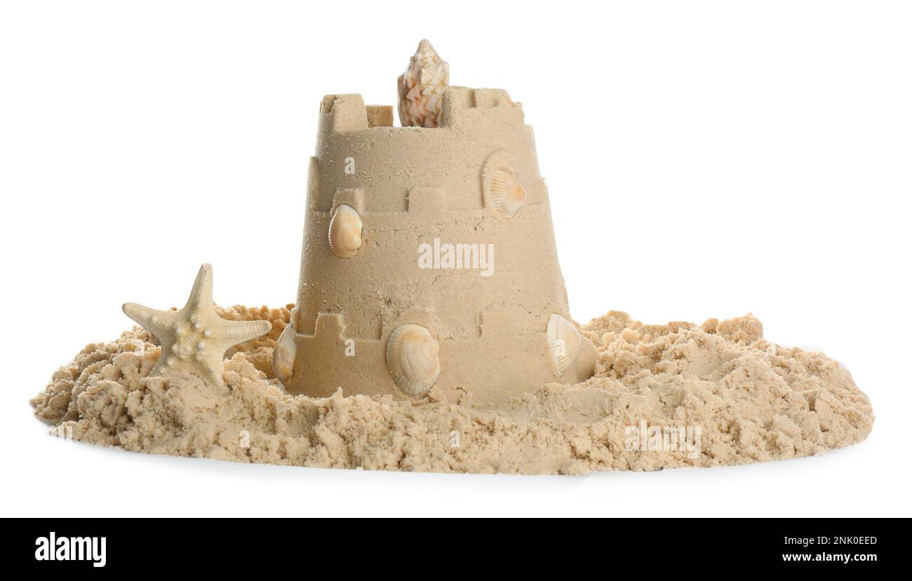 Sand castle with shells and starfish on white background. Outdoor play