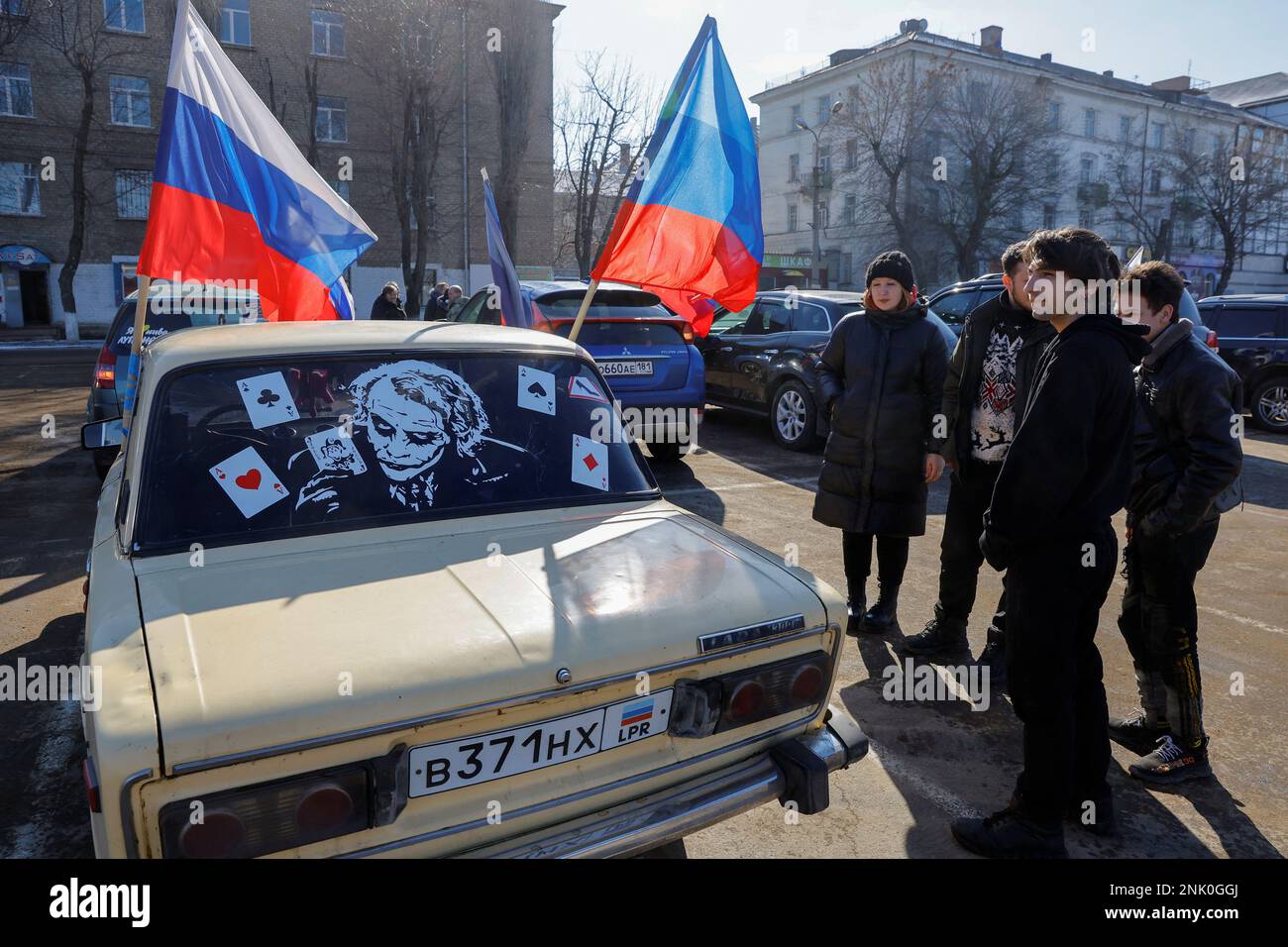 Participants gather near cars before the start of an automobile rally marking Russia's Defender of the Fatherland Day in the course of Russia-Ukraine conflict in Luhansk, Russian-controlled Ukraine, February 23, 2023. REUTERS/Alexander Ermochenko Stock Photo