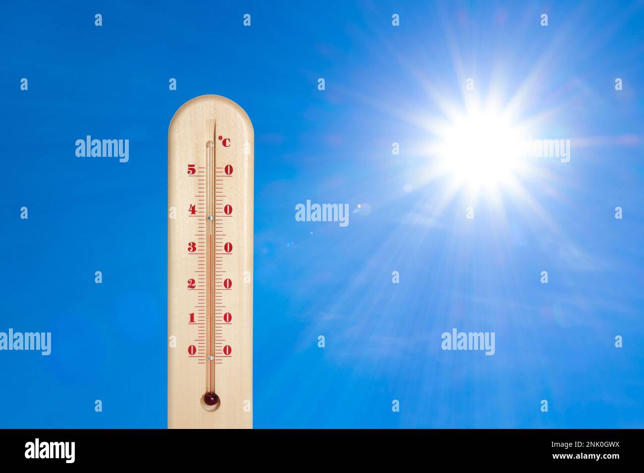 Weather thermometer with high temperature outdoors on hot sunny day