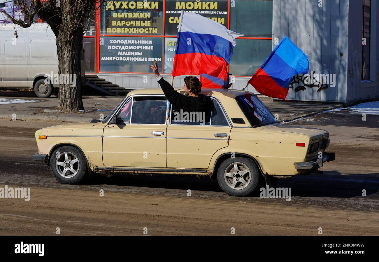 Participants drive a car during an automobile rally marking Russia's Defender of the Fatherland Day in the course of Russia-Ukraine conflict in Luhansk, Russian-controlled Ukraine, February 23, 2023. REUTERS/Alexander Ermochenko     TPX IMAGES OF THE DAY Stock Photo