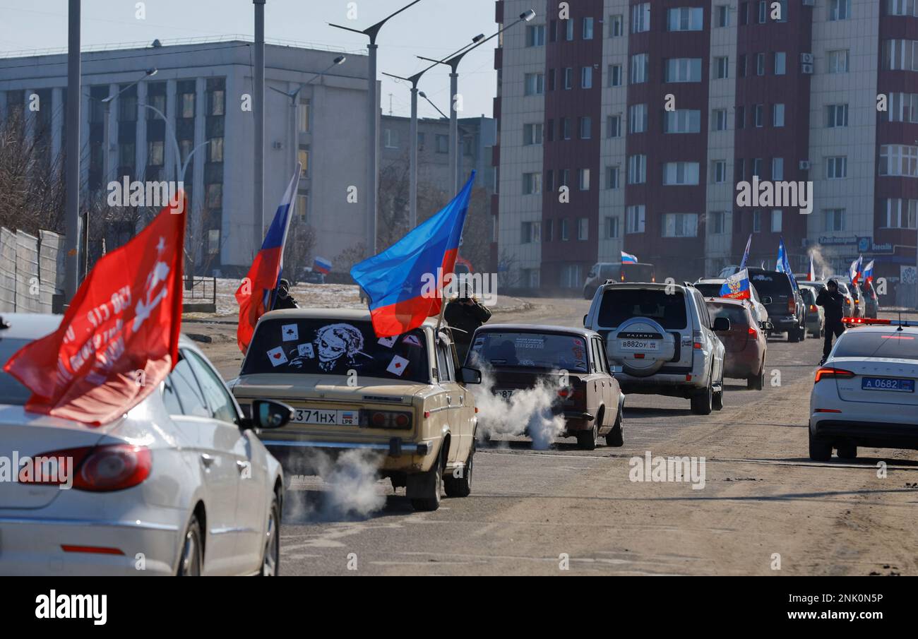 Participants drive cars during an automobile rally marking Russia's Defender of the Fatherland Day in the course of Russia-Ukraine conflict in Luhansk, Russian-controlled Ukraine, February 23, 2023. REUTERS/Alexander Ermochenko Stock Photo