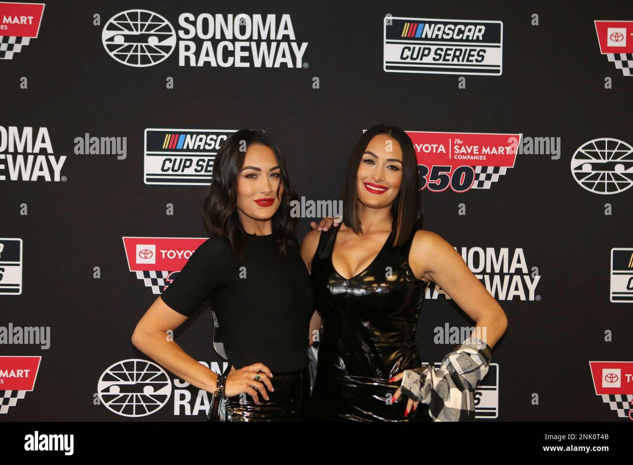 SONOMA, CA - JUNE 12: Professional tag team wrestlers The Bella Twins, Brie  Bella (left) and Nikki Bella (right) during a pre race press conference for  the NASCAR Cup Series Toyota/Save Mart
