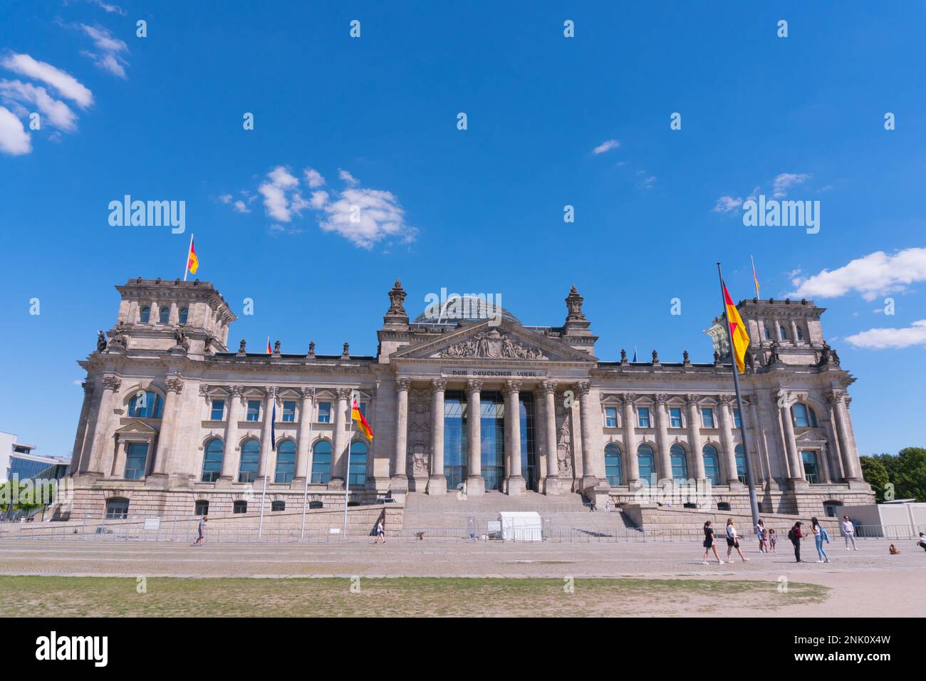 Berlin, Germany circa July, 2018: The Reichstag facade with German flags Stock Photo