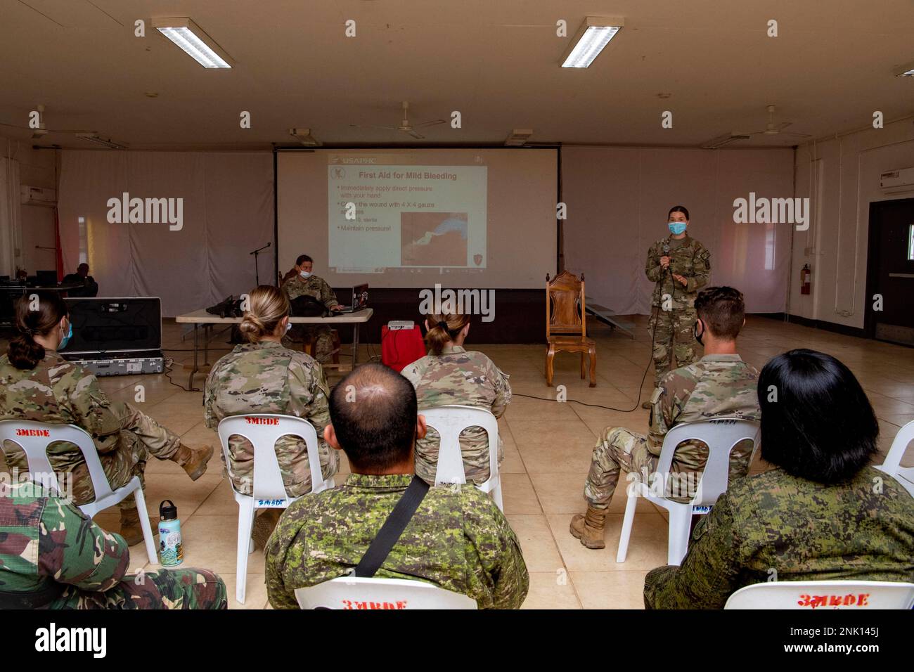 PUERTO PRINCESA, Philippines (Aug. 10, 2022) – Capt. Kathleen Stewart, from Colorado Springs, Colorado, presents to U.S. and Armed Forces of the Philippines (AFP) service members during a K-9 Tactical Combat Casualty Course at AFP’s 3rd Marine Brigade Headquarters in support of Pacific Partnership 2022. Now in its 17th year, Pacific Partnership is the largest annual multinational humanitarian assistance and disaster relief preparedness mission conducted in the Indo-Pacific. Stock Photo