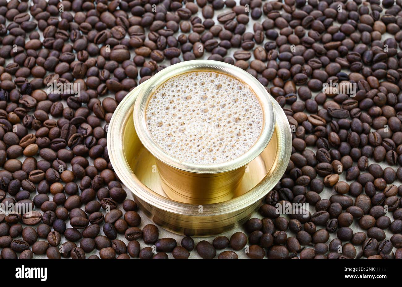 Indian filter coffee in a brass cup Stock Photo