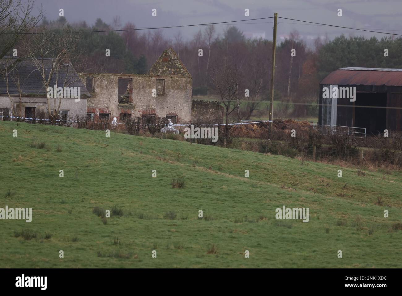 Forensice officers at property in Drumnakilly, where a vehicle was