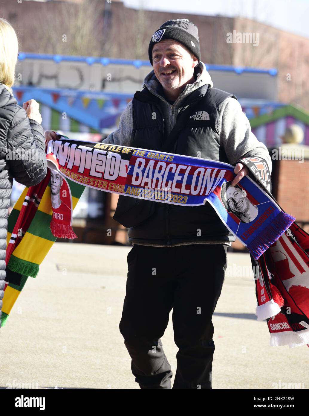 Manchester, UK, 23rd February, 2023. Man selling MUFC Barcelona