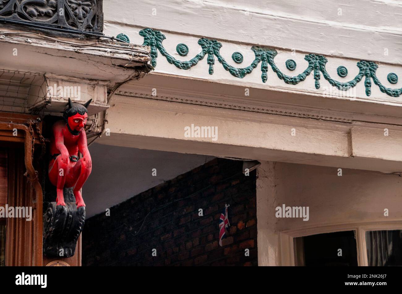 The Red Printers Devil wood carving in York, England is a symbol of a